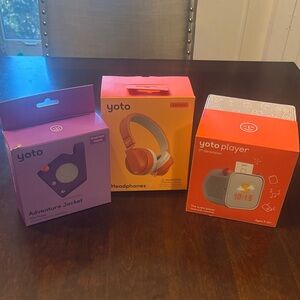 Brand new Yoto with headphones and protective jacket